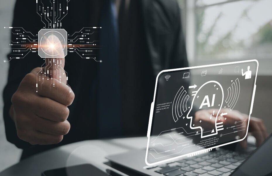 Business professional using AI tools on laptop with holographic AI interface, representing artificial intelligence for small businesses in 2026