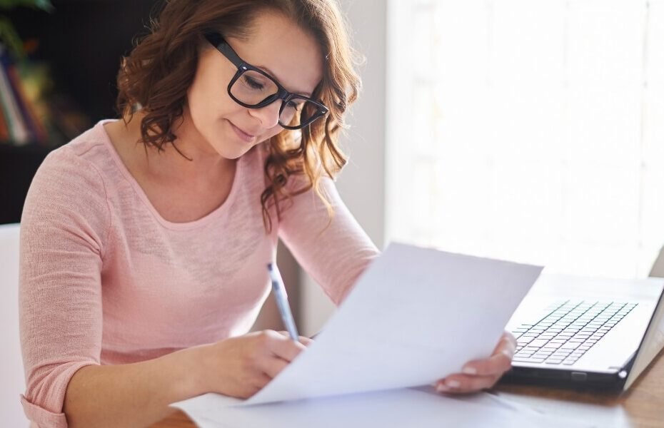 Content editor reviewing AI-generated article to make it sound more human and natural for SEO