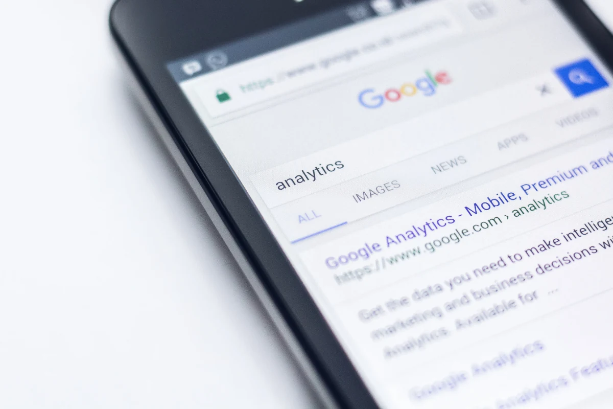 Close-up of a smartphone showing a page of Google search results