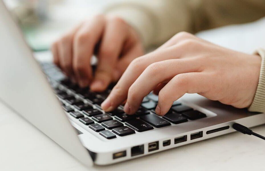 SEO specialist updating website content on a laptop as part of a quick SEO optimisation strategy